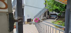 an external view of a house with a balcony with flowers at Petrucci House in Vasto