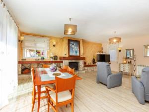 a kitchen and living room with a table and chairs at Villa Villa Cantos by Interhome in L'Ametlla de Mar +34 photos