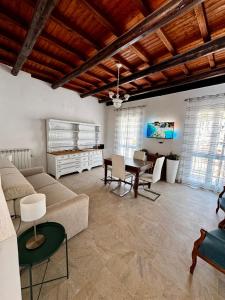 a living room with a couch and a table at Families or Groups 3 Terrazzi Penthouse on Sea w Ac in Vernazza