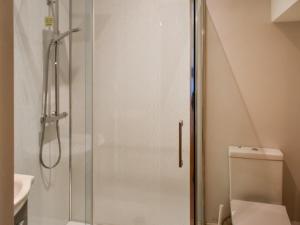 a shower stall in a bathroom with a toilet at Periwinkle No5 - Uk49249 in Althorne