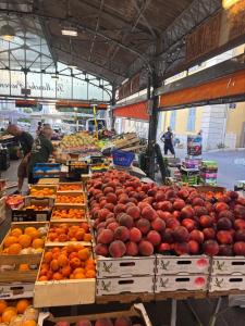 a market with many boxes of apples and oranges at Le Pavillon du Cap d'Antibes in Antibes