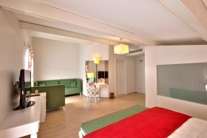 TV a/nebo společenská místnost v ubytování Baga Hotel