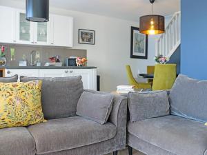 a living room with a couch and a table at Deerview Lodge - Uk51044 in Bonvilston
