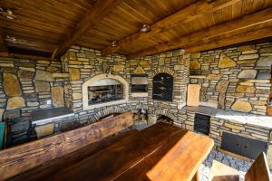 a large stone room with a wooden bench in it at Kamienny Horyzont in Bereżnica Wyżna +33 photos