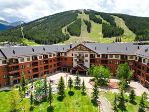 an apartment building with a mountain in the background at CS221 Copper Springs in Copper Mountain