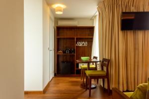a living room with a table and a dining room at Hotel The Exchange in Amsterdam +81 photos