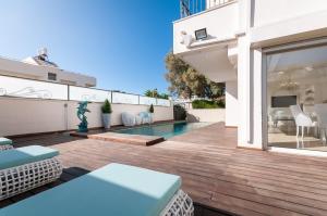 a house with a swimming pool and a patio at Cosytal Villa in Herzliya