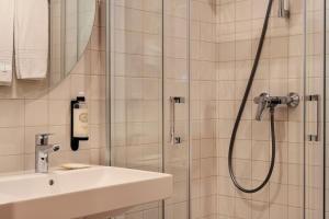 a bathroom with a shower and a sink at Cova da Iria Hotel in Fátima +48 photos