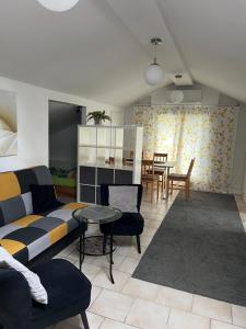 a living room with a couch and a table at Pokoje in Duszniki Zdrój +24 photos