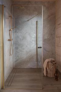 a shower with a glass door in a bathroom at Ziębowe Ranczo in Chochołów +21 photos