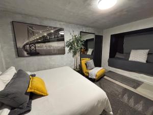 a bedroom with a bed and a yellow chair at Zion Base 3BR Home Backyard Oasis Pets Welcome in St. George