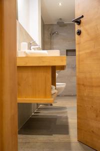 a bathroom with a sink and a toilet at Bockwirt in Schladming +34 photos