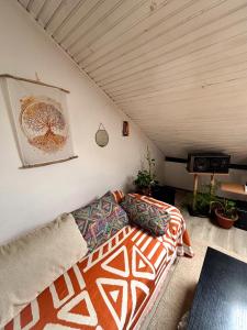 a living room with a couch in a room at The Vibe Spot in Podgorica