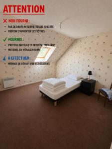 a bedroom with a bed with a poster on the wall at Maison 3 chambres in Morlaix