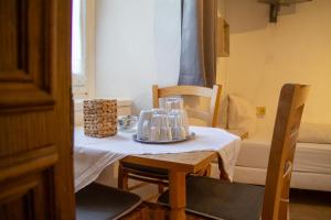 a small table with a white table cloth on it at Bockwirt in Schladming