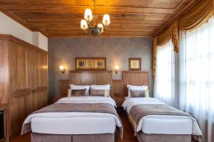 Postel nebo postele na pokoji v ubytování Ferman Konak Hotel-Special Category