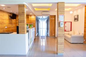 a lobby of a hospital with a white couch at Holiday Home Resort & Spa in Jarosławiec