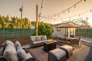 a patio with a couch and a table with a fire pit at Downtown Truckee Walkable 6 Bed Pet Friendly in Truckee