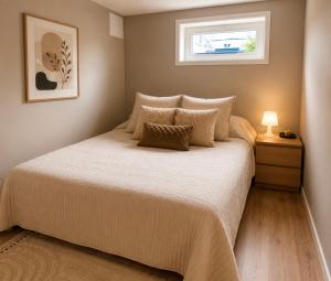 a bedroom with a bed and a window at Leilighet Preikestolen in Strand