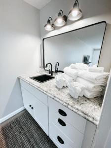 a bathroom with a sink and a mirror at Meadow Room at The Trailblazer Unit 12 in Townsend +15 photos