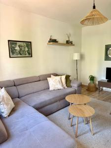 a living room with a couch and a table at Guest house Kamelija in Budva