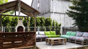 a group of couches sitting under a gazebo at Schullandheim Neukirch Lausitz in Meyershäuser