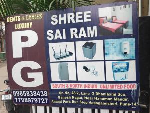 a sign for a store with a sign for a spa ram at Shree Sai Ram PG in Pune