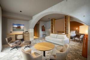 a living room with a couch and a table at La Chapelle in Annecy