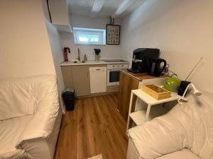 a small room with a bed and a kitchen at LaSa Apartment 2 in Villingen-Schwenningen