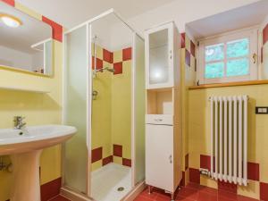 a bathroom with a sink and a shower at Apartment Betulla by Interhome in Rabbi