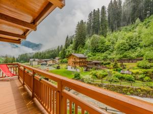 a view from the balcony of a cabin in the mountains at Apartment Betulla by Interhome in Rabbi