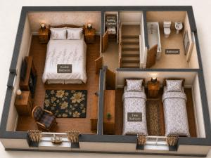 a model of a bedroom with a bed at Endeavour Cottage Whitby Quiet Old Yard Fishermans Cottage in Whitby