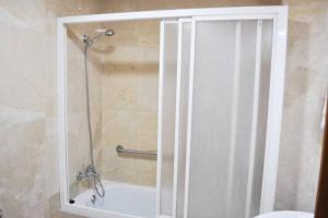 a shower with a glass door in a bathroom at Villaviciosa in Villaviciosa +17 photos