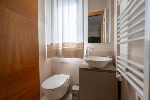 a small bathroom with a toilet and a sink at ReDavid House Villa in Torre a Mare