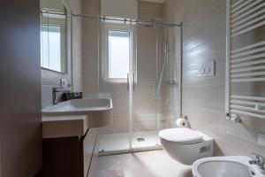 a bathroom with a shower and a toilet and a sink at ReDavid House Villa in Torre a Mare