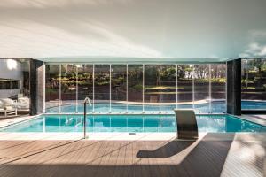 a swimming pool with a view of a house at Onyria Marinha Cascais, Vignette Collection by IHG in Cascais +89 photos