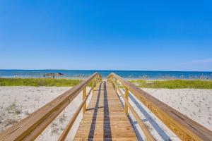 a wooden boardwalk leading to the beach at Windward Crest by Pristine Properties Vacation Rentals in Port Saint Joe
