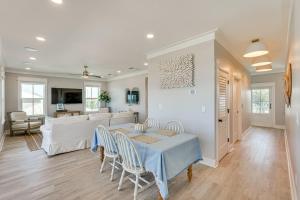 a dining room and living room with a table and chairs at Windward Crest by Pristine Properties Vacation Rentals in Port Saint Joe