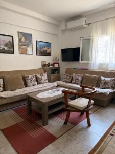 a living room with a couch and a coffee table at The Lakehouse in Krnjice