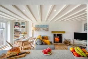 a living room with a table and a fireplace at 2 Bed in Llanfair oc-a30451 in Llanfair