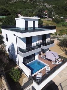 an aerial view of a house with a swimming pool at Villa Nova Bar in Bar