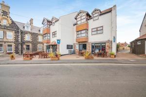 a row of buildings on a city street at 2 Bed in Bamburgh oc-nb282 in Bamburgh