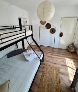 a bedroom with a bunk bed and a lamp at Os Marias in Tomar +15 photos