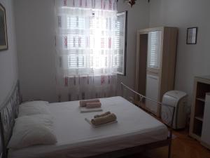 Posteľ alebo postele v izbe v ubytovaní Guesthouse Villa Klaic