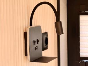 a lightswitch on the side of a wall at Luxury Houseboat Wolphaartsdijk VP109 in Wolphaartsdijk