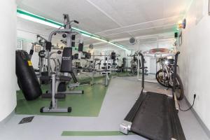 a room with a gym with a bike in it at Dizma Welness Apartmani in Duće