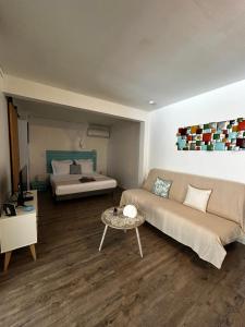a living room with a couch and a table at Petit Havre Bleu in Le Gosier +44 photos