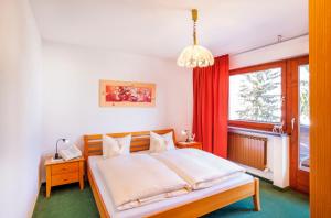 Postel nebo postele na pokoji v ubytování Sporthotel Pechtl