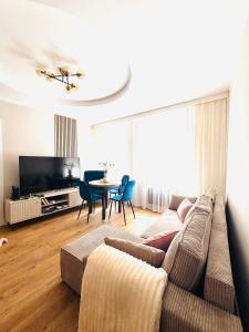 a living room with a couch and a table at Sowia Przystań in Nowa Ruda
