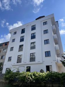 a white building with windows on it at Royal Batın Apart Otel in Trabzon